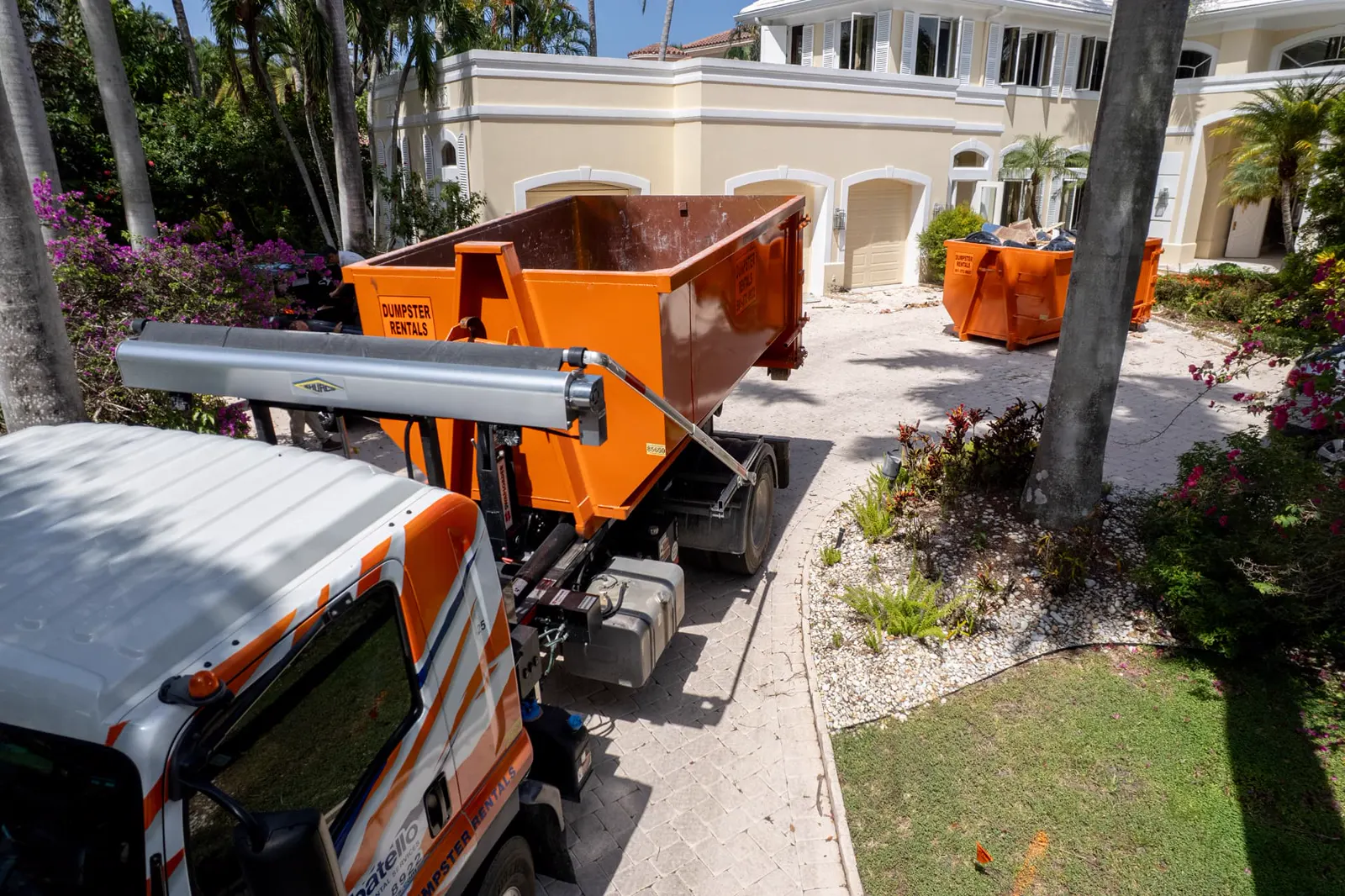 Sabatello orange roll-off dumpster ready for delivery